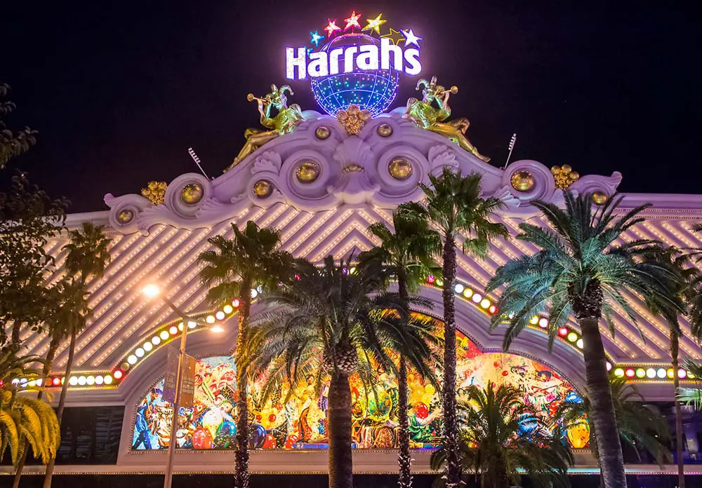 Las Vegas Strip FREE Walking Tour & Map (19 Must-See Stops!) 15 Walking by Harrah's on the Strip at night
