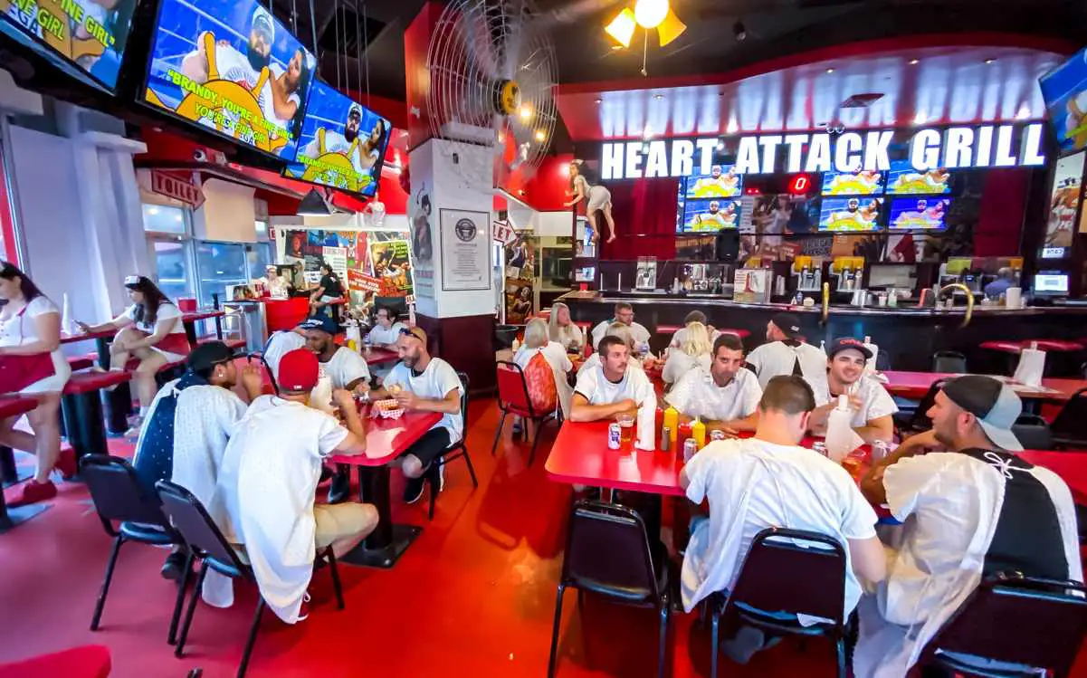 Heart Attack Grill Menu, Prices, & Hours (Las Vegas Restaurant) 3 "Patients" at the Heart Attack Grill restaurant on Fremont Street in downtown Las Vegas