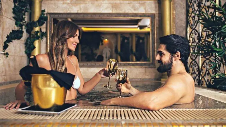 Couple enjoying in room hotel jacuzzi.