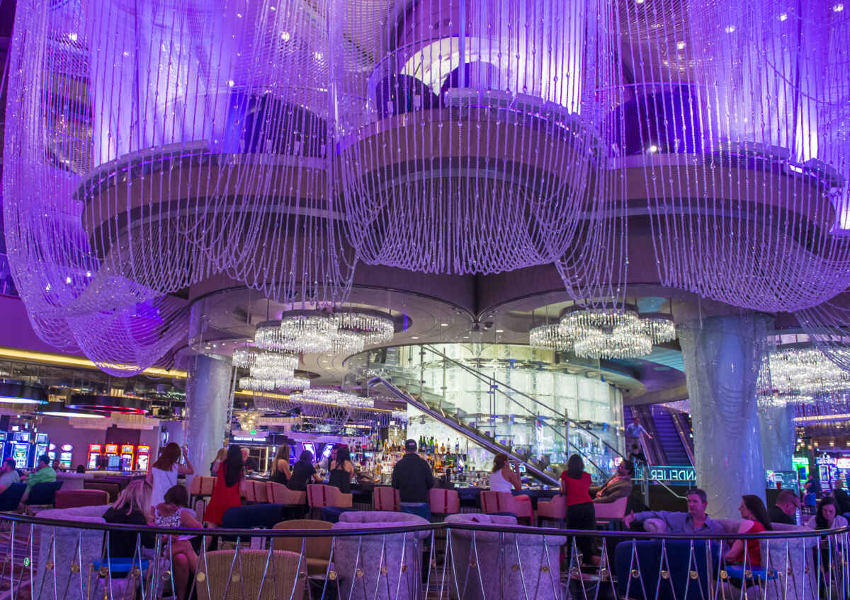 Sip in Style: The Chandelier Bar Las Vegas Unveils a World of Crystal Elegance and Artful Mixology 4 Reserving a table at The Chandelier Bar at The Cosmopolitan.